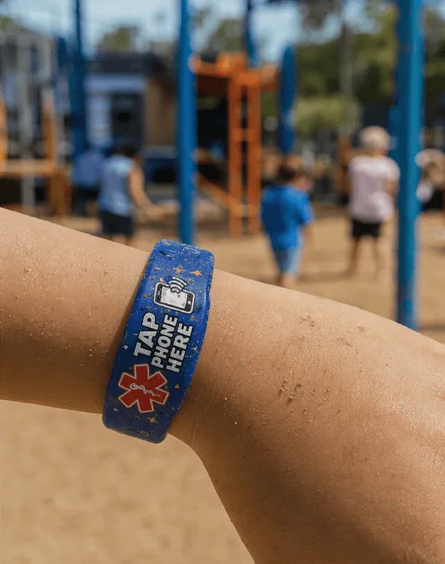 A child at the playground wearing the Space band